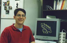 Picture of Dr. Shaw at a computer terminal